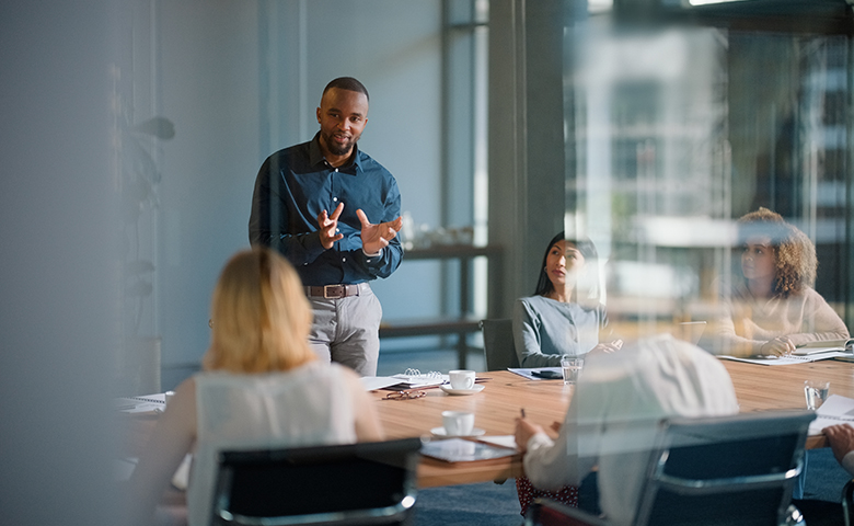 Businessman telling a SafeStart story before their meeting begins