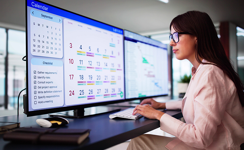 Employee Working On Calendar Schedule