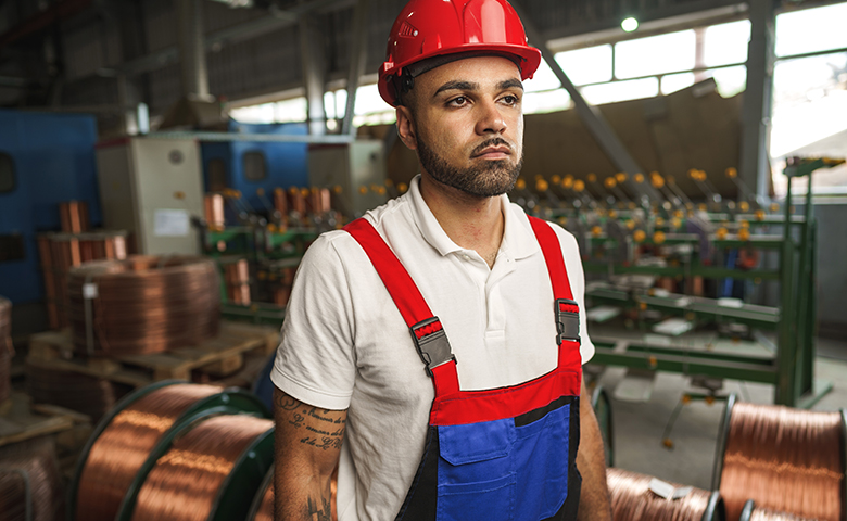 Complacent worker in cable production plant