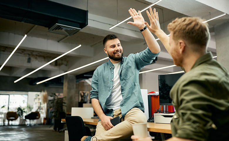 High fives for achievements in the workplace